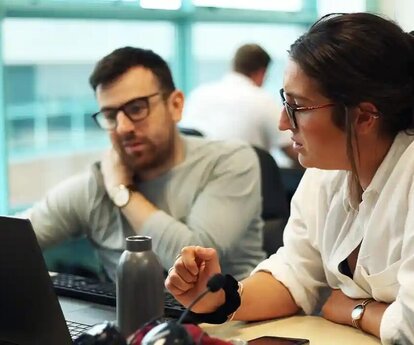 RWA Employees looking at a laptop